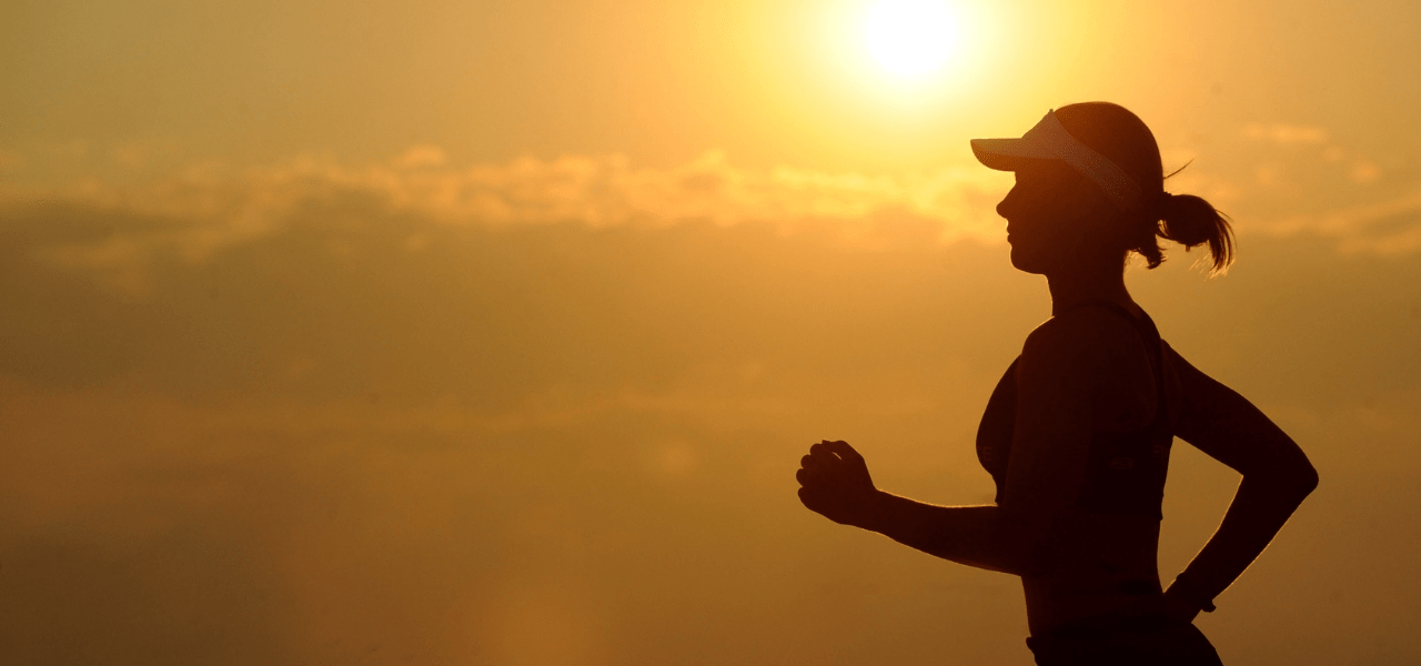 A female student running to get some exercise to improve her mental health.