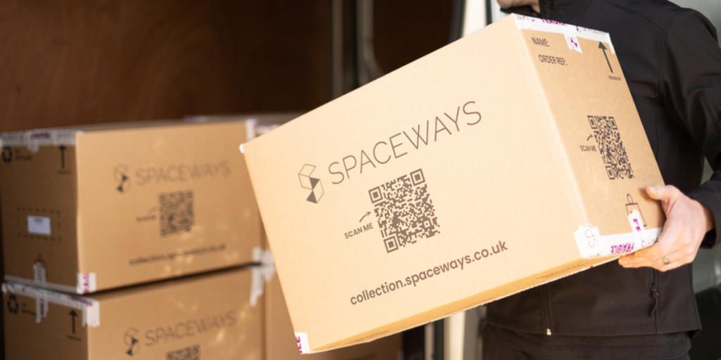 picture of a Spaceways worker loading Spaceways boxes into a Spaceways van