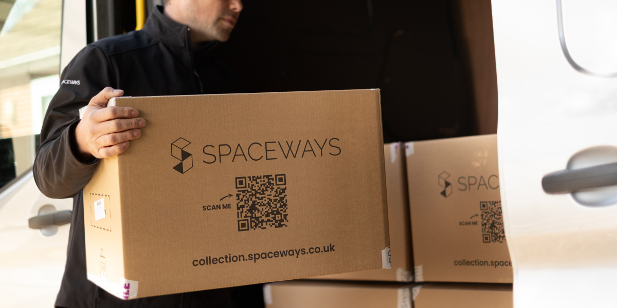 Picture of a student storage worker loading an international students boxes onto a van